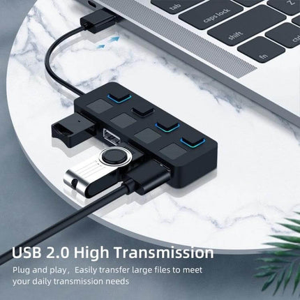 USB Hub with 4 Switched Ports for Easy Device Connections - compact USB 2.0 hub plugged into laptop with multiple devices attached