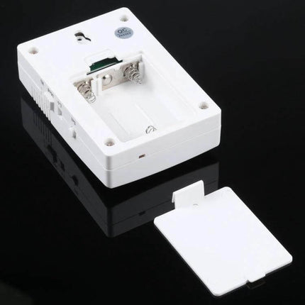 VOYE Wireless Doorbell for Home Entry Notifications with Custom Sounds white battery compartment and removable cover on black background