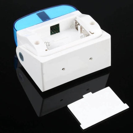 Easy-to-Use Wireless Doorbell for Homes and Businesses white battery compartment with open cover and blue translucent top