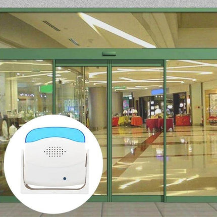 Easy-to-Use Wireless Doorbell for Homes and Businesses mounted near commercial entrance with 3-7m detection and light-sensing for battery savings