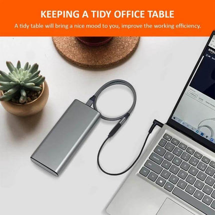 USB-C Laptop Charging Cable for Compatible Devices, 1.5 Meters connected between power bank and laptop on tidy desk