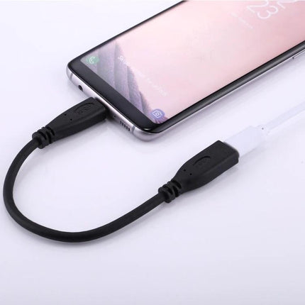 USB-C Adapter Cable for Everyday Device Charging Needs - Type-C male to female extension cable shown charging a smartphone on a desk