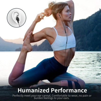 Langsdom Wired In Ear Headset With Comfort Fit For Commuting woman doing yoga outdoors wearing wired in-ear headset