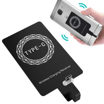 Essential Wireless Receiver for Daily Type-C Phone Charging on desk pad with compact Type-C wireless receiver plugged in