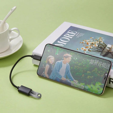 Essential Charging Cable for Daily Mobile Device Needs - durable USB charging and syncing cable powering smartphone during commute and travel