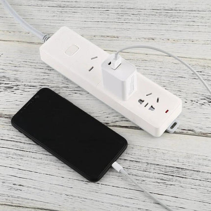 18W AU Plug Power Adapter for Travel and Daily Use charging smartphone on power strip, compact lightweight travel charger