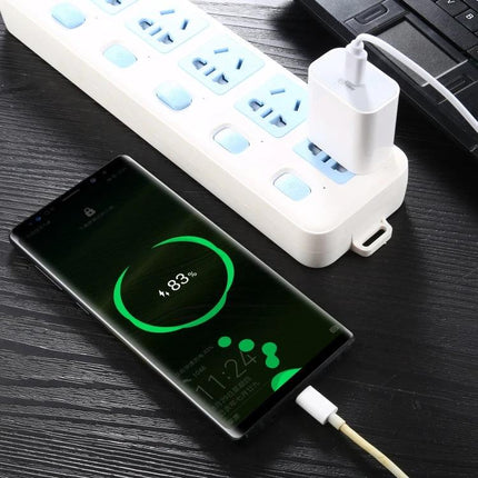 Compact AU Plug Wall Charger for Daily Home and Travel Use charging smartphone from power strip, compact white charger plugged in and cable connected