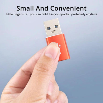 This adapter connects USB-C devices for everyday charging - compact reversible Type-C adapter held between fingers