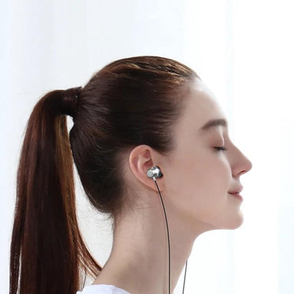 Wired Earphones for Daily Music and Commute Essentials with Type-C connector and HD microphone shown in-ear on commuting user
