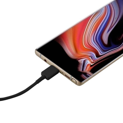 USB-C Charging Cable for Everyday Device Powering at Home plugged into smartphone on a desk, fast charging cable in use