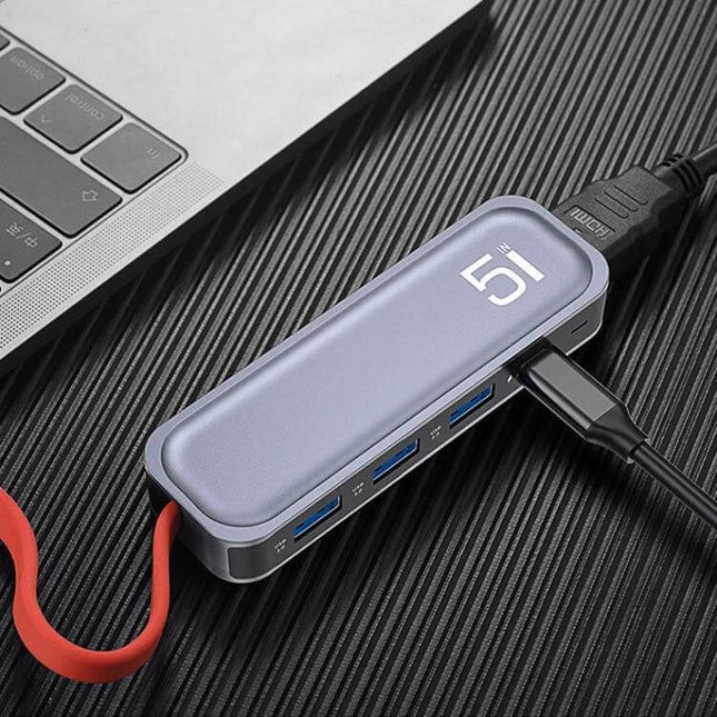 ROCK USB-C Docking Station with HDMI and USB Expansion Ports connected to laptop showing HDMI and multiple USB 3.0 ports for mobile workstation setups