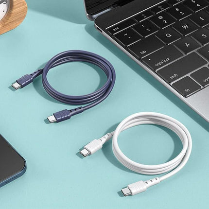 REMAX USB-C to USB-C Cable for Daily Device Charging at Home – two durable USB-C charging cables beside laptop and phone, built-in smart chip for everyday use