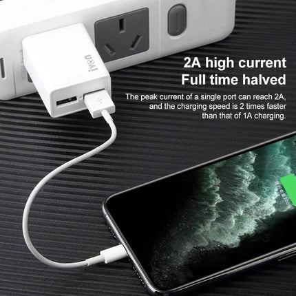 Ivon Travel Charger for Everyday Device Charging Needs compact dual-port USB charger plugged into outlet charging smartphone with 2A high current