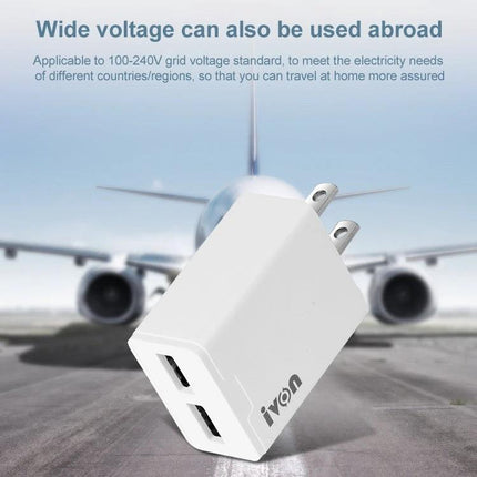 Ivon Travel Charger for Everyday Device Charging Needs compact dual-port white USB charger with US prongs shown with airplane background