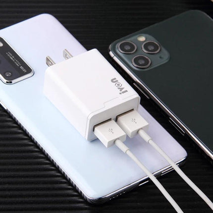 Ivon Travel Charger for Everyday Device Charging Needs compact dual USB charger powering two phones on the go