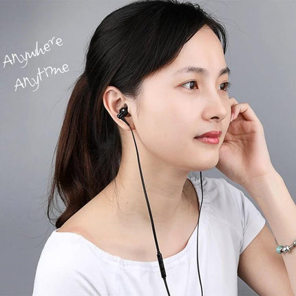 Wired Stereo Earphones With 3.5mm Jack For Commuting And Work woman wearing ergonomic wired earphones with inline control commuting