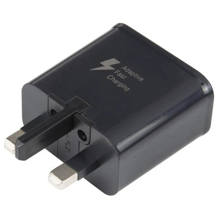 Essential Travel Adapter for Daily Device Charging compact black UK-plug adapter with adaptive fast charging text
