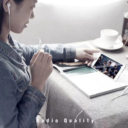 Daily Adapter for 3.5mm Headphones on Type-C Devices connected to phone for commuting music and calls, woman using earphones with tablet nearby