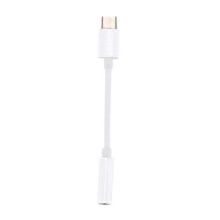 Use this USB-C to 3.5mm adapter for everyday phone audio connections. White compact USB-C to 3.5mm headphone adapter for on-the-go use