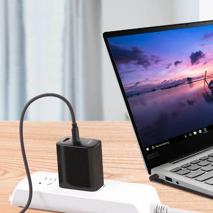 USB-C to 4.0mm Laptop Charging Cable, 1.5 Meters Long connected to laptop via power adapter on desk