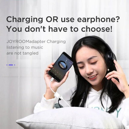 Joyroom Adapter for Daily USB-C Audio Connections - woman using adapter to charge phone and use headphones