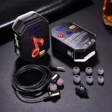 QKZ In-Ear Headphones With Four Drivers For Commuting showing earbuds, cable, extra tips, and packaging