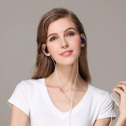 Alt Tag: QKZ In-Ear Headphones With Noise Reduction For Commute model wearing wired earbuds during commute-ready listening session