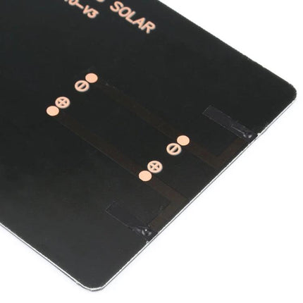 Portable DIY Solar Panel for Educational Projects and Battery Charging close-up of black circuit contacts on compact solar panel for students and hobbyists