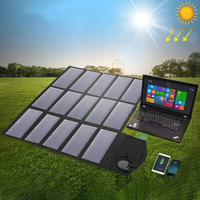 ALLPOWERS 100W Foldable Portable Solar Panel Charger laid out on grass charging a laptop and phones under sunlight, portable camping solar charger