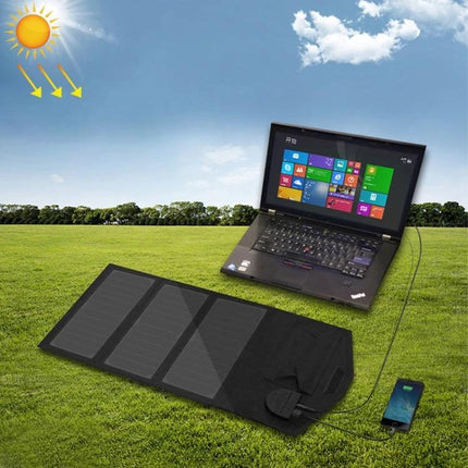 ALLPOWERS Foldable Waterproof Solar Charger for Portability charging phone and laptop outdoors on grass under sun