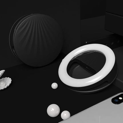 Versatile Clip-On Light for Daily Selfies and Social Media shown clipped near a smartphone, circular LED ring brightening face for low-light selfies