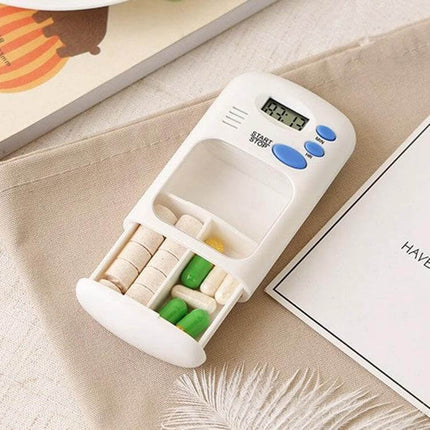 Smart Portable Pill Reminder Box With Multi Alarm Timer For Meds in white, two large compartments shown with pills and digital timer