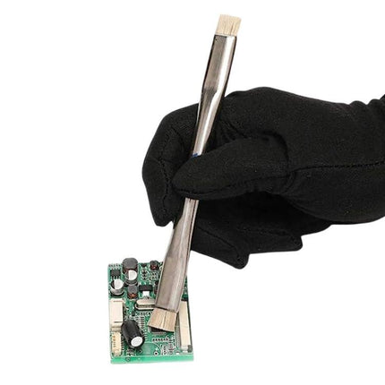 Double-Head Anti-Static Brush for Electronics Cleaning being used to gently remove dust from a circuit board