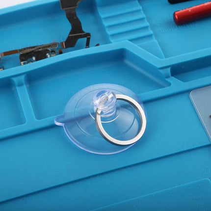 Compact Suction Cup Tool for Glass and Screen Separation on repair mat, clear suction cup with metal ring for lifting mobile screens
