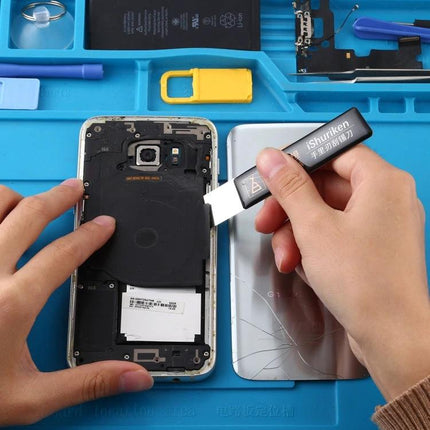 Qianli iShuriken 0.2mm Scraping Knife for Safe Electronics Work - hand using metal scraper to lift smartphone adhesive safely