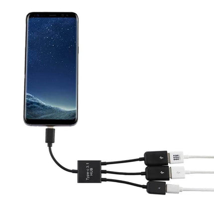 Portable USB-C Adapter with Dual USB and Micro USB Ports connected to smartphone with two USB devices and a Micro USB cable for charging and data