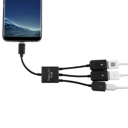 Portable USB-C Adapter with Dual USB and Micro USB Ports connected to smartphone, powering and linking three peripherals