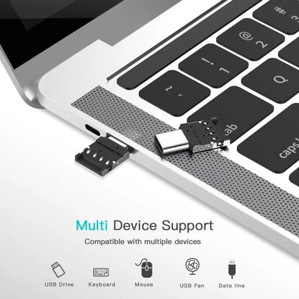Compact USB-C Adapter for On-the-Go Phone Data Transfer - compact adapter next to laptop showing USB drive connection for quick photo and file transfers