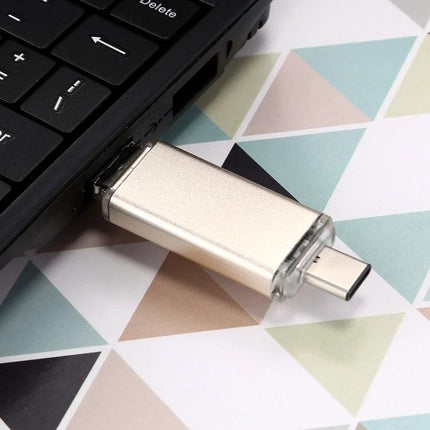 A Compact 32GB USB Drive for Daily File Transfers on Devices plugged into laptop USB-C port, metallic compact stick for photo backup and file sharing