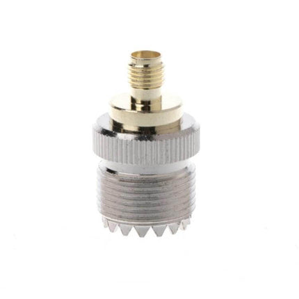 4-Piece RF Adapter Set for PL259 to SMA Connectors Brass PL259 to SMA adapter close-up for amateur radio antenna and signal testing