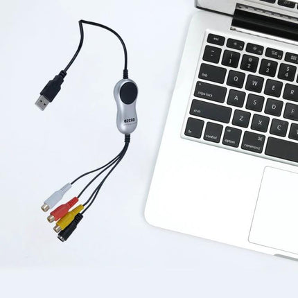 EZCAP Device for Capturing Analog Videos to Computer connected to laptop with RCA composite and S-video cables for digitizing VHS tapes