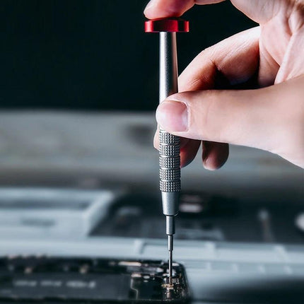 Precision Phillips Screwdriver for Phone and Device Repair being used to tighten a tiny screw on a smartphone motherboard