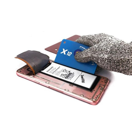 Mechanic Anti-Static Tool for Safe Phone Battery Removal being used to lift a smartphone battery with a plastic pry card to prevent scratches and static discharge