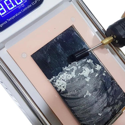 Martview Magic Scrub LCD Glue Remover Head Set of 5 Pieces being used to remove glue from a smartphone screen during repair