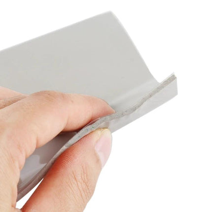 Grey Heat Insulation Working Mat for Electronics Soldering, 10x10cm — close-up of grey heat-resistant mat held by hand for soldering work