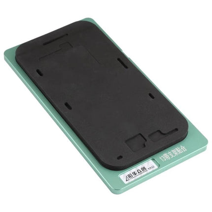 iPhone 13 Screen Repair Positioning Mat with Frame Bezel on green metal base for accurate screen alignment and secure component placement