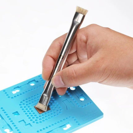 2UUL Double-Headed Bristle Brush for Electronics Cleaning and Dust Removal being used to clean a circuit board with dual brush heads