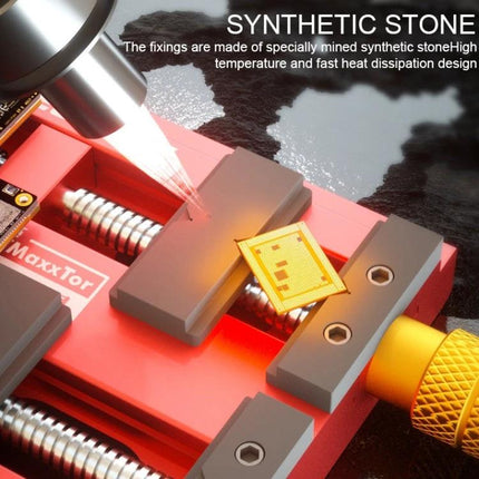 Mechanic MaxxTor Four-Axis Drive Motherboard Repair Fixture holding a PCB under a heat tool for soldering and inspection