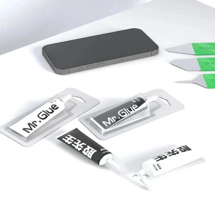 2UUL Mr Glue 25ml Adhesive for Phone and Toy Repairs bottle and applicators beside a smartphone for small electronics and toy fixes