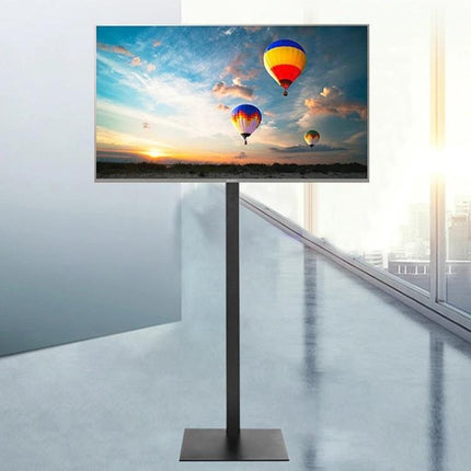 Height Adjustable TV Floor Stand with 360 Degree Rotation for TVs standing in modern living room showing hot air balloon screen